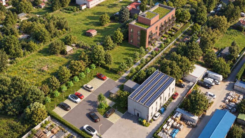 Investičný projekt Komunita Malý Dunaj – letecký pohľad na bytový dom so zelenou strechou a parkovaním v Podunajských Biskupiciach
